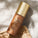 The image features a bottle of